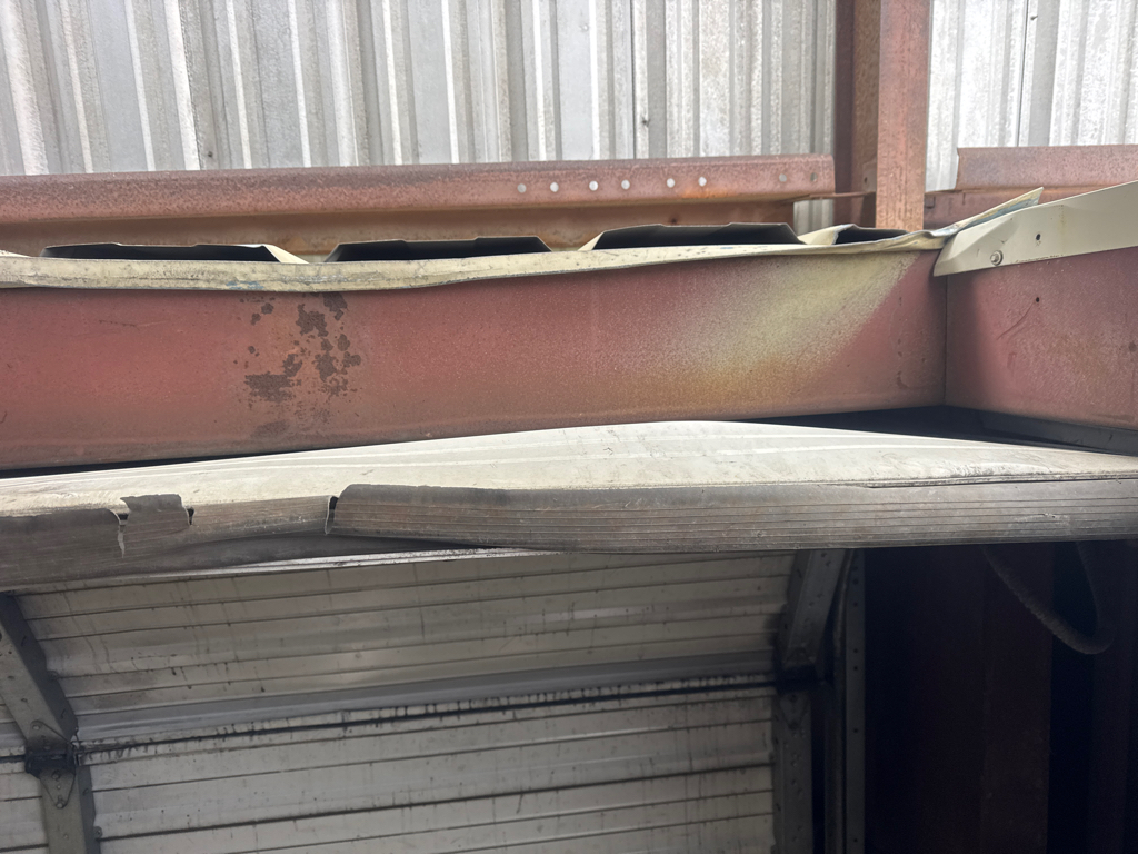 garage panel repair for impact damage on  garage door.