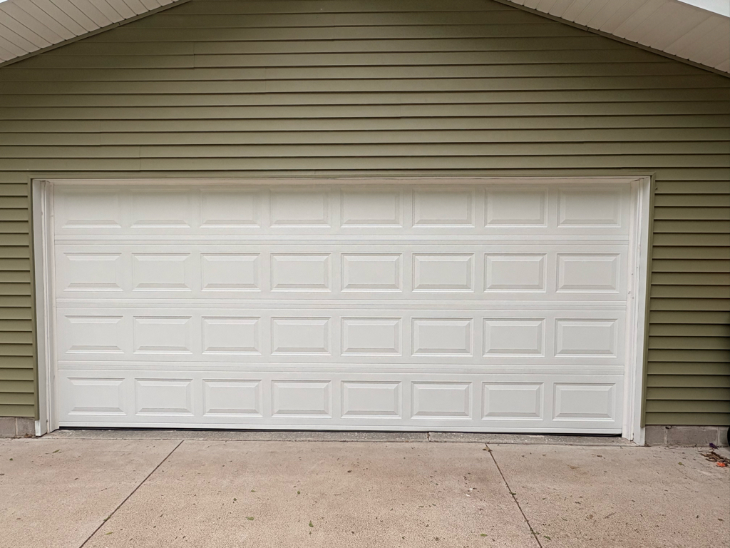  Residential garage door installation with sectional panels
