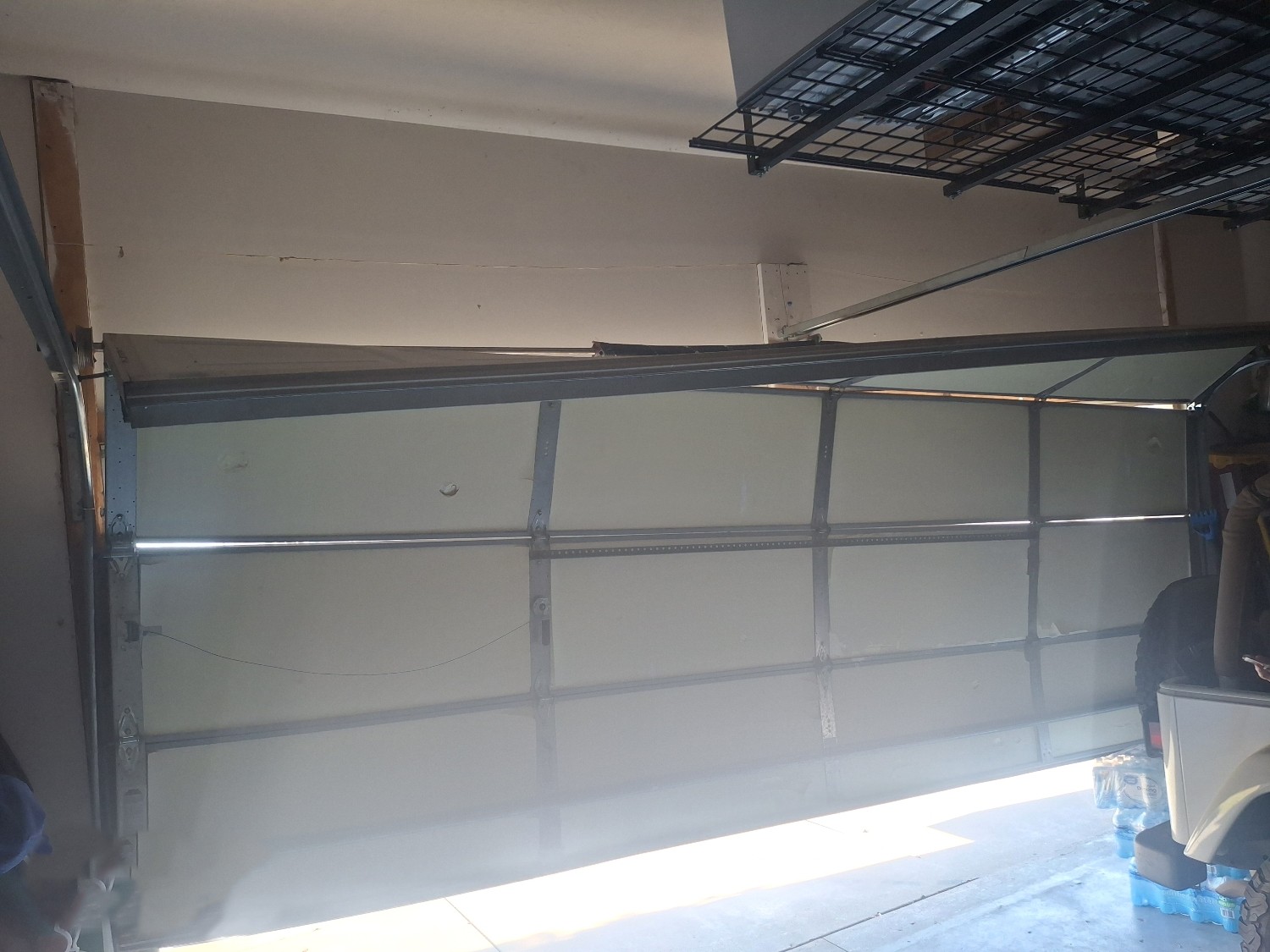 Door Estimate, 12528 S 218th St, Gretna, Nebraska, 68028-3 Garage door off-track repair for a misaligned sectional door