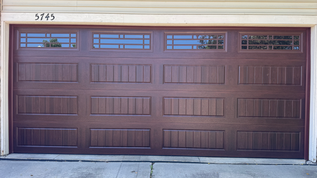 New garage door installation with sectional door panels