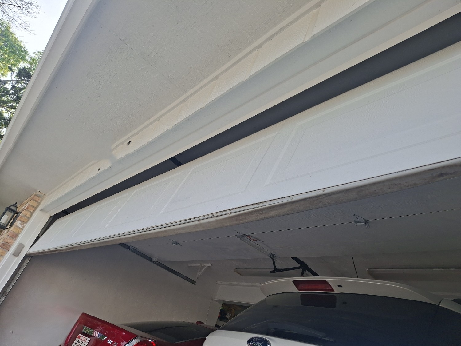  Residential overhead garage door off-track repair