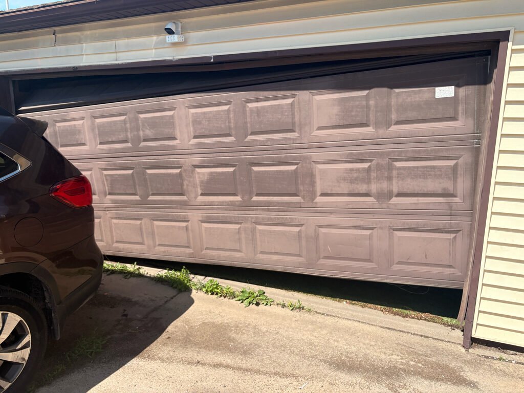  Garage door off-track repair and track alignment